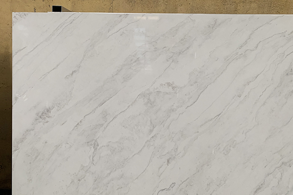 bright white quartz slab with marble looking vein